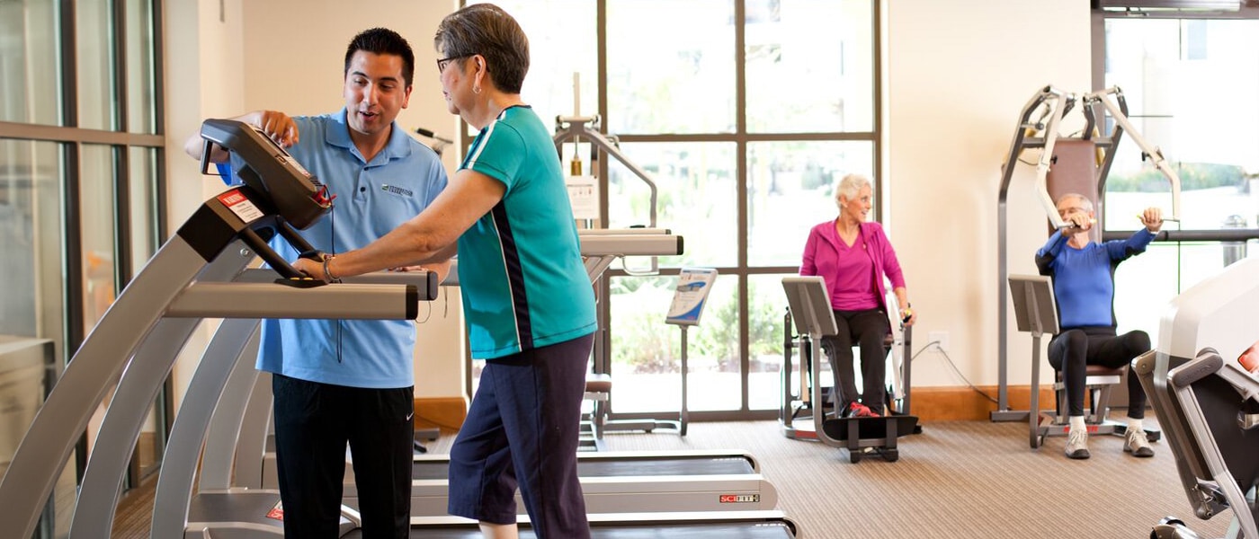 stoneridgecreek-1400x600-3 Residents exercising in the gym at Wisteria