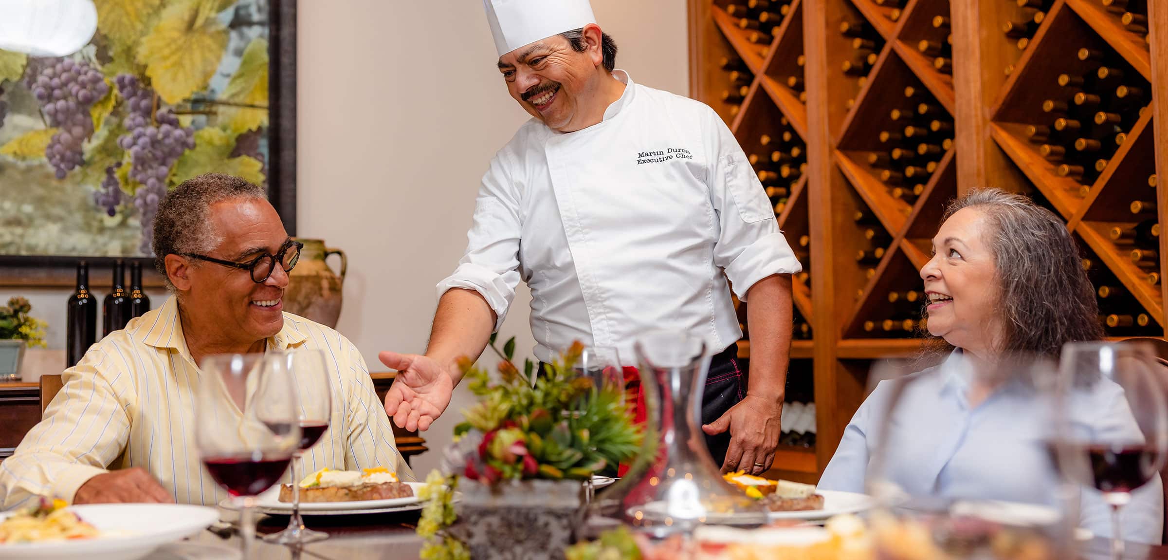 ReataGlen-600x600-3 A chef giving residents food