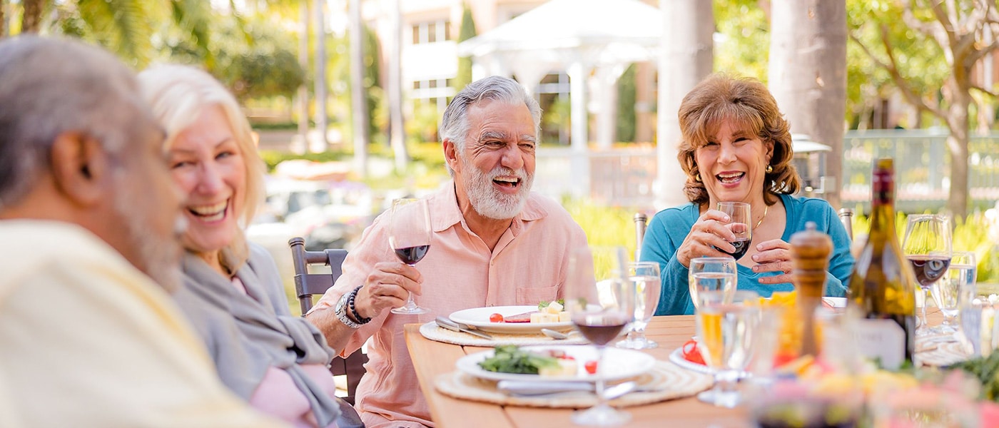 A group of residents eating outside
