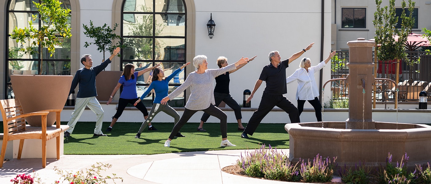 morningside-1400x600-19 A group of residents doing yoga outdoors